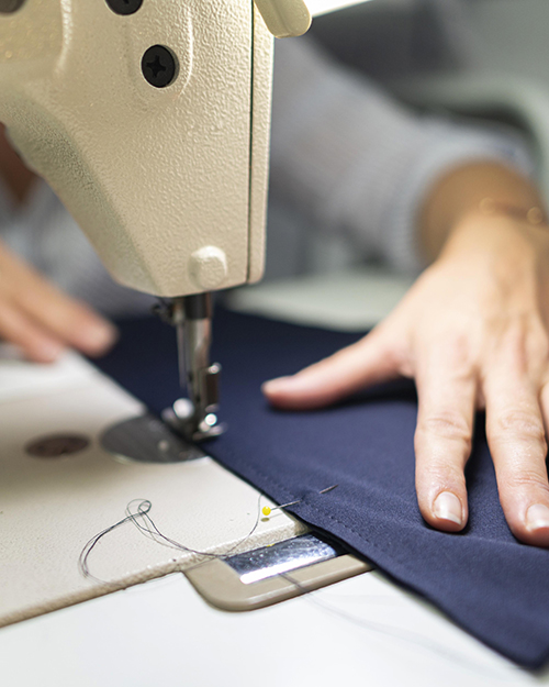 close-up-hands-using-sewing-machine (1)